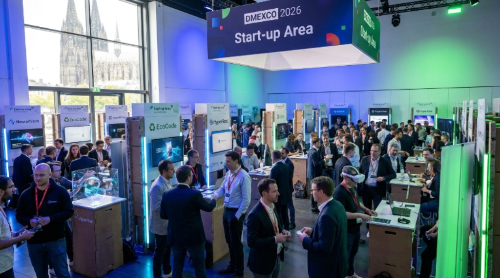 Visitors networking and exploring exhibition booths at the DMEXCO 2026 Start-up Area inside Koelnmesse, Cologne, Germany
