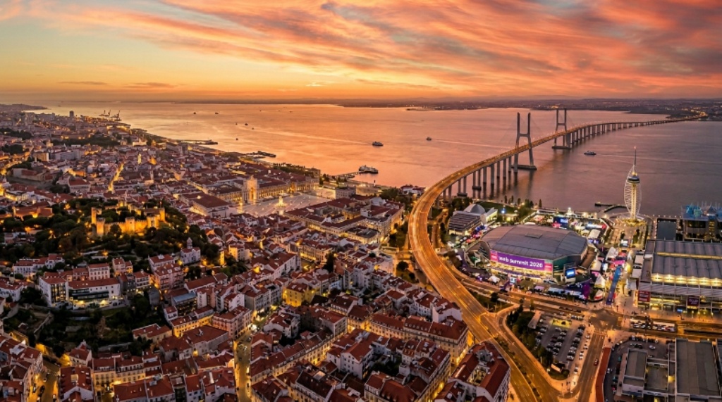 Aerial view of Lisbon, Portugal at sunset, the host city of Web Summit 2026, with the Tagus River and Parque das Nações district visible in the background